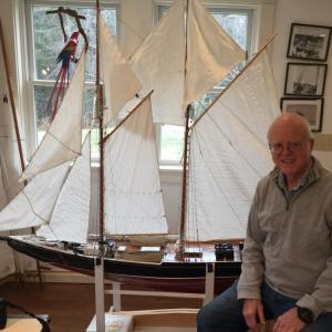 John Dunsford displays his favorite model schooner, a Blue Nose from Lunnenburg, Nova Scotia. BILL PEARSON/Boothbay Register