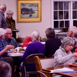 People enjoy the pasta dinner at the Congregational Church on Saturday, Jan. 19, a fundraiser for local Coast Guard families. Bob Crink photo