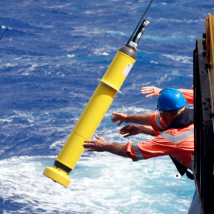 Researchers deploy an instrument called an Argo float to take oceanographic measurements. A new study found that microscopic marine plants thrive beneath the sea ice that covers the Greenland Sea. Photo by Alicia Navidad/Commonwealth Scientific and Industrial Research Organisation