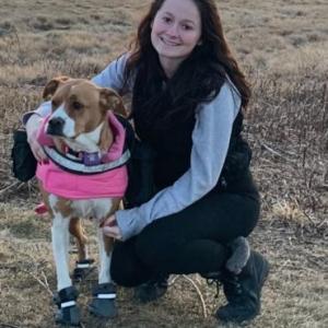 Martina Baker of Wiscasset with her service dog, Caiohme. Courtesy of Loretta Leighton