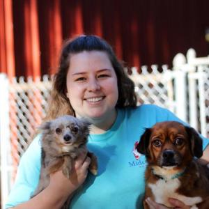 Abby Malone, adoption program supervisor, holds Peanut Butter and Jelly, who were adopted together from Midcoast Humane in the fall following a seizure case. Courtesy of Midcoast Humane