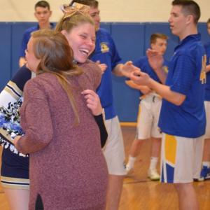 Seahawk cheerleader Natalia Gosselin hugs coach Elizabeth Tilton Feb. 6 during Senior Night as the school recognized students participating in their final winter co-curricular activity. BILL PEARSON/Boothbay Register
