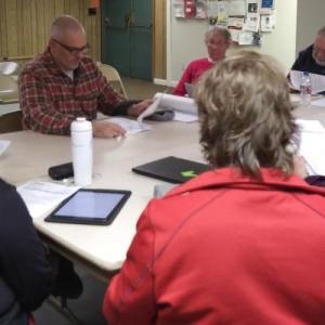 Malcolm Goeschl, third from left, discusses plans for his Clifford Road property with Edgecomb planning board members. JANE CARPENTER/Boothbay Register