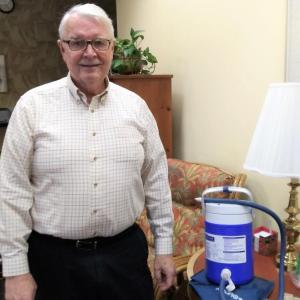 Community Center president Shawn Lewin stands next to an AIRCAST CRYO CUFF recently donated to the Center’s free medical supplies closet. JANE CARPENTER/Boothbay Register