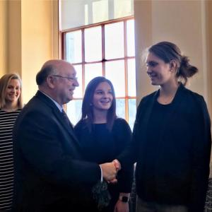 Sen. Dana Dow shakes hands with team co-captain Faith Blethen during the team’s visit at the State House March 28. Courtesy photo
