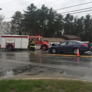 Firefighters at the scene of the accident on Route 27 on Tuesday. JOSEPH CHARPENTIER/Boothbay Register