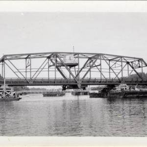 The swing span is drifted into place. Courtesy of MDOT historic bridge archives