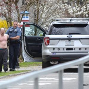 Chief Bob Hasch, left, and Officer Aaron Beck escort Konstantinos Rigas to the police car after the standoff. JOSEPH CHARPENTIER/Boothbay Register