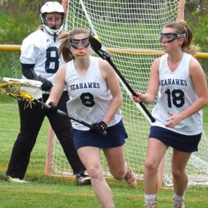 Boothbay defender Hannah Cola, left, moves up field May 29 in her team’s 15-12 loss to undefeated Winslow at Sherman Field. BILL PEARSON/Boothbay Register