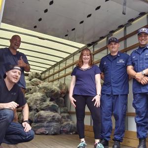 Glad the heavy lifting is over are truck driver Josh Hammons (kneeling, left,) Richard Christopher, volunteer, Jen Field, Community Center secretary, Adam Smart, Officer-in-Charge and Tom Moen, Petty Officer of the Coast Guard in Boothbay Harbor. JANE CARPENTER/Boothbay Register
