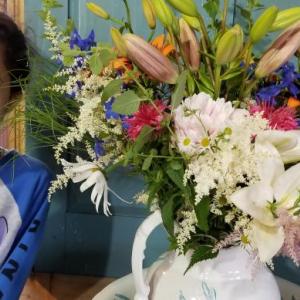 Lexi, with a bouquet of flowers. Courtesy photo