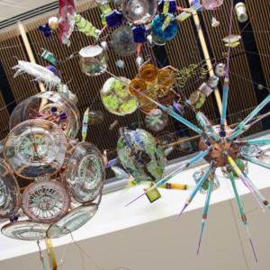 Algae-inspired pieces of glass art hang together in a new installation at Bigelow Laboratory for Ocean Sciences. A special Café Sci event at Bigelow Laboratory on Tuesday, July 9 at 5 p.m. will highlight the work of the artist-scientist team that produced this work, as well the work of several other teams that are fusing science and art. Courtesy of Bigelow Laboratory for Ocean Sciences