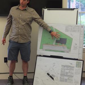 At the July 10 Boothbay planning board meeting, Knickerbocker Group senior architectural designer Randy Smith explains plans for demolishing the former Pinkham’s Seafood building on Route 27 and constructing a new building for making gourmet popcorn and fudge. BILL PEARSON/Boothbay Register