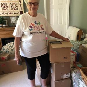 Sue Burge, founder of Set For Success, sorts deliveries for this year’s back-to-school effort. JENNY BENNETT/Boothbay Register