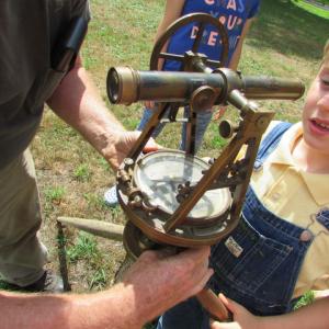 A young man learns about 18th century surveying at the Lincoln County Historical Association’s Summer children’s program, Summer with the Past. A few spaces are available for the August session. Courtesy photo
