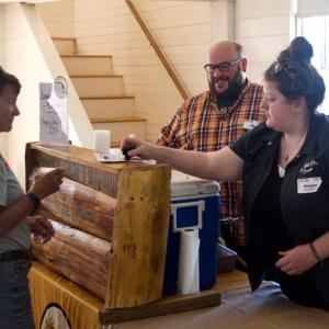 Rails, Tails & Ales skews to an older crowd than typical of many brew fests. A police officer is on hand, and Village volunteers check IDs carefully. Photo by Bob Crink.