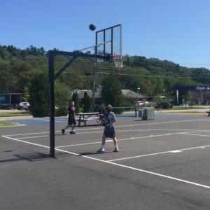 Two boys enjoy one of the last days of summer vacation on the new basketball court. JOSEPH CHARPENTIER/Boothbay Register