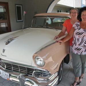 Karen Westhaver, front, executive director of Schooner Cove Retirement Community and Wanda Wilcox, executive director of Chase Point Assisted Living, pose with a 1956 Ford Fairlane, one of the many antique cars on display at the sixth annual Antique Car Show and Elvis Extravaganza Aug. 13. Courtesy of LincolnHealth