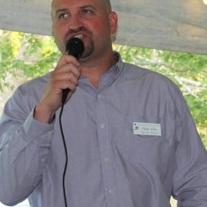 Boothbay Region Land Trust Executive Director Nick Ullo addresses the 194 guests attending the Aug.8 art auction at Oak Point Farm. BILL PEARSON/Boothbay Register