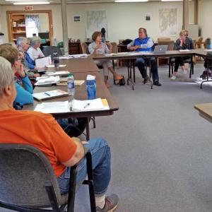 Pictured in the back are Peggy Schaffer, ConnectME executive director (left), and Mark Ouellette, Axiom Technologies (center), at the recent meeting of the Broadband Planning Committee. Courtesy of Mary Ellen Barnes