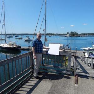 Boothbay Harbor resident and planning board member Chris Swanson gives an example of where one of the Museum in the Streets signs might go. Courtesy photo