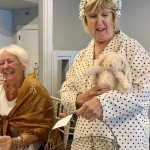Terry Heller enjoys Terri Wells’ model turn that included saying she insisted she get to hold a toy bunny. SUSAN JOHNS/Wiscasset Newspaper
