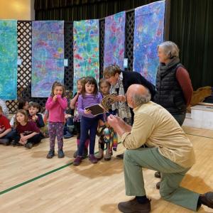 Kindergartners present the book they created to Roger Gies about their experiences in CTL's new outdoor classroom. Courtesy of CTL