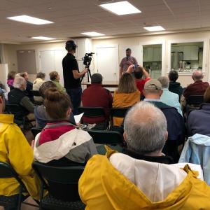Dan Bryer addresses a packed room at Boothbay Harbor Congregational Church. JENNY BENNETT/Boothbay Register