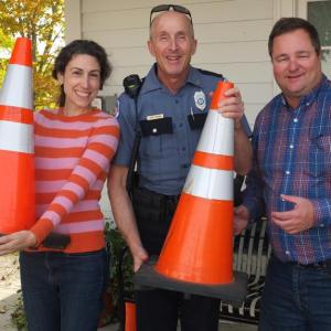 Desiree Scorcia of Boothbay Harbor Memorial Library and Boothbay Harbor Police Officer Larry Brown, center, explain annual Halloween parade route changes to Boothbay Register reporter Bill Pearson. Courtesy of Boothbay Harbor Police Chief Bob Hasch