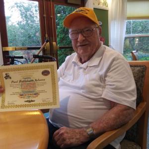 Paul Adams shows his certification for the Holland Club, marking 50 years of qualifying for submarines. JANE CARPENTER/Boothbay Register
