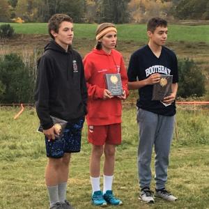 The top three individual boy runners at the 2019 Busline League championship cross-country meet are, from left, Austin Trask of the Wiscasset team, third place; Henry McDevitt of Camden-Rockport, runner-up; and Dominick Dow of Boothbay Region, first place. Hildy Johnson photo