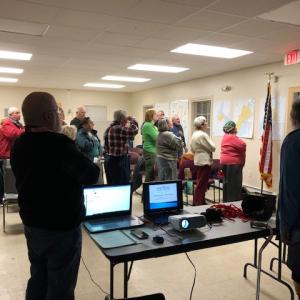 Lincoln County Republicans beginning the Nov. 20 meeting with the Pledge of Allegiance. Courtesy photo