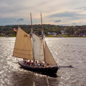 The newly renovated schooner Mary E sails the Kennebec River in 2019, slightly downriver from where she was launched in 1906. Courtesy of Maine Maritime Museum
