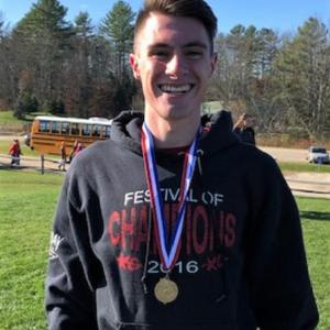 Will Perkins strikes a pose with his gold medal after winning the Class C state championship. Courtesy photo