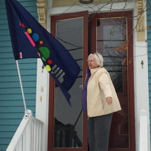 Margaret Perritt received her Boothbay Lights flag Dec. 5 and displayed it outside her Townsend Avenue home to promote local business. BILL PEARSON/Boothbay Register