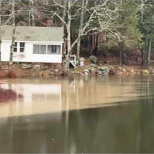 A brown plume of soil from erosion in the watershed turned part of Knickerbocker Lake brown on Saturday. Courtesy of BRWD