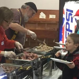 The Boothbay Community Christmas Dinner drew nearly 125 to the American Legion Hall Dec. 25. BILL PEARSON/Boothbay Register
