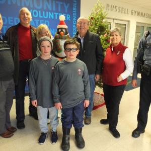 2019 Penguin Plunge honorary volunteers Ted and Betty Repa passed the ‘torch’ to this year’s selection Dave and Mary Patch Dec. 11 at BRYMCA. Pictured from left, front, Hannah Hills and Byran Hills; back, Y aquatics instructor Daniel Parrot, Ted Repa, Betty Repa, Dave Patch, Mary Patch and Boothbay Harbor police patrolman Larry Brown. BILL PEARSON/Boothbay Register