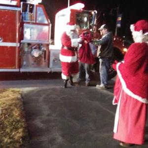 Santa and Mrs. Claus arrive at the Boothbay town office by fire truck on Saturday, Nov. 30. JANE CARPENTER/Boothbay Register