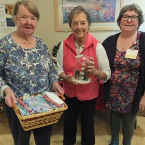 Safe Havens residents Sue Keene, left, and Carol Wandeloski, center, display their handmade crafts created in the past two months during a St. Andrews Retirement Village activity led by Events Coordinator Wendy Wood, right. BILL PEARSON/Boothbay Register