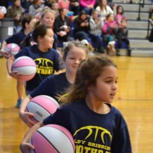 The Lady Dribblers ran around the court Jan. 4 prior to making their season debut during halftime at the Boothbay-Lisbon girls varsity game. BILL PEARSON/Boothbay Register