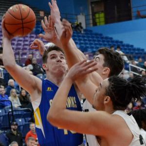 Boothbay senior Hunter shoots against Waynflete’s tall frontline Feb. 20 in the Class C South semifinal. No. 3 Boothbay lost 53-41 against the second-ranked Flyers. KEVIN BURNHAM/Boothbay Register