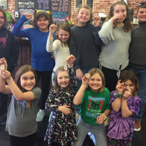 Ten local youths show their personalized key chains made Feb. 18 at Harbor Tech’s second Kids Day. Courtesy photo