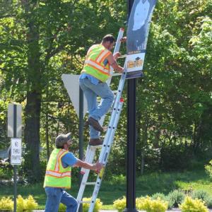 Boothbay Public Works employees spent Wednesday morning placing graduation banners for the Boothbay Region High School Class of 2020 on Route 27. BILL PEARSON/Boothbay Register