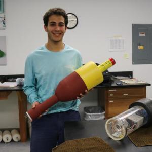 UMaine engineering alum Joshua Girgis, building a buoy prototype at the Darling Marine Center, Walpole. Courtesy photo