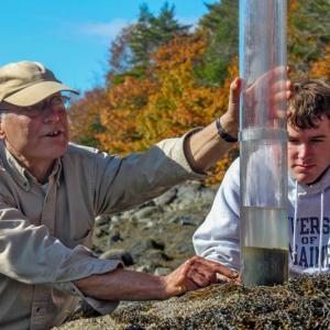 Larry Mayer working with a University of Maine student on the shore of the Damariscotta River. Courtesy of DMC.