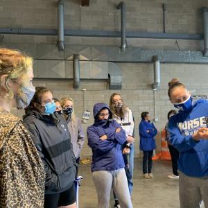 Morse High School Assistant Principal Devon Gallice reviews plans with seniors at Wiscasset Municipal Airport June 11. SUSAN JOHNS/Wiscasset Newspaper