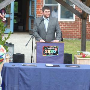 Edgecomb Eddy Principal Ira Michaud congratulates the school’s 11 graduates during the June 5 ceremony. BILL PEARSON/Boothbay Register