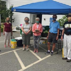 Each Friday, masked volunteers supply local residents with groceries at Boothbay Region Food Pantry at Boothbay Harbor Congregational Church. From left are Betsy Hastings, Peter Gardner, Andrea Hutchins, Bawn Clifton, Jane Lunt, Greg Barter, Fleet Davies and Barbara Fritz. BILL PEARSON/Boothbay Register