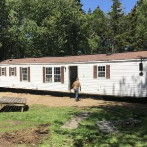 The new trailer for a Southport family is moved into place in mid-June. Courtesy of Jack Herger